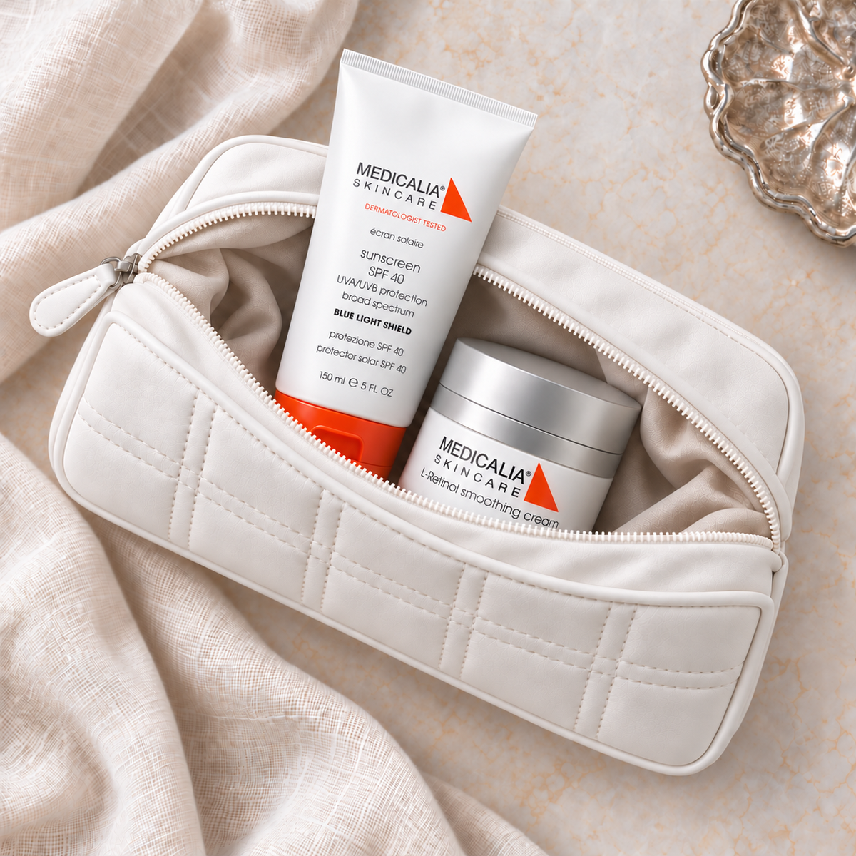MEDICALIA L-Retinol & Sunscreen Gift Bag with the gift pouch open. File: medicalia-l-retinol-and-sunscreen-gift-bag-open-pouch-2026.png