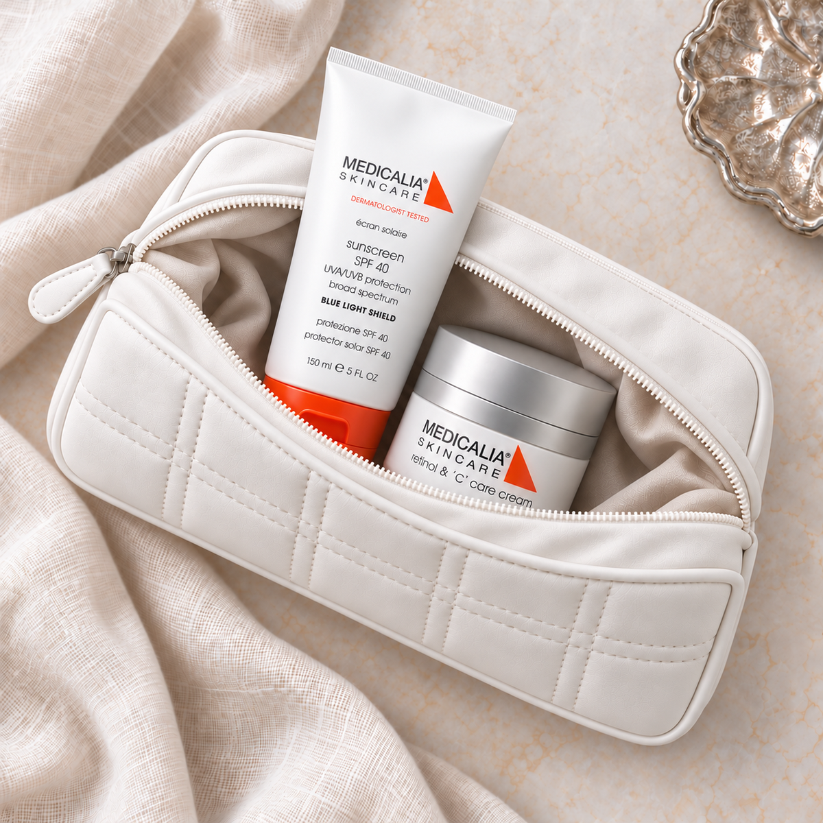 MEDICALIA Retinol and C & Sunscreen Gift Bag with the gift pouch open. File: medicalia-retinol-and-c-and-sunscreen-gift-bag-open-pouch-2026.png