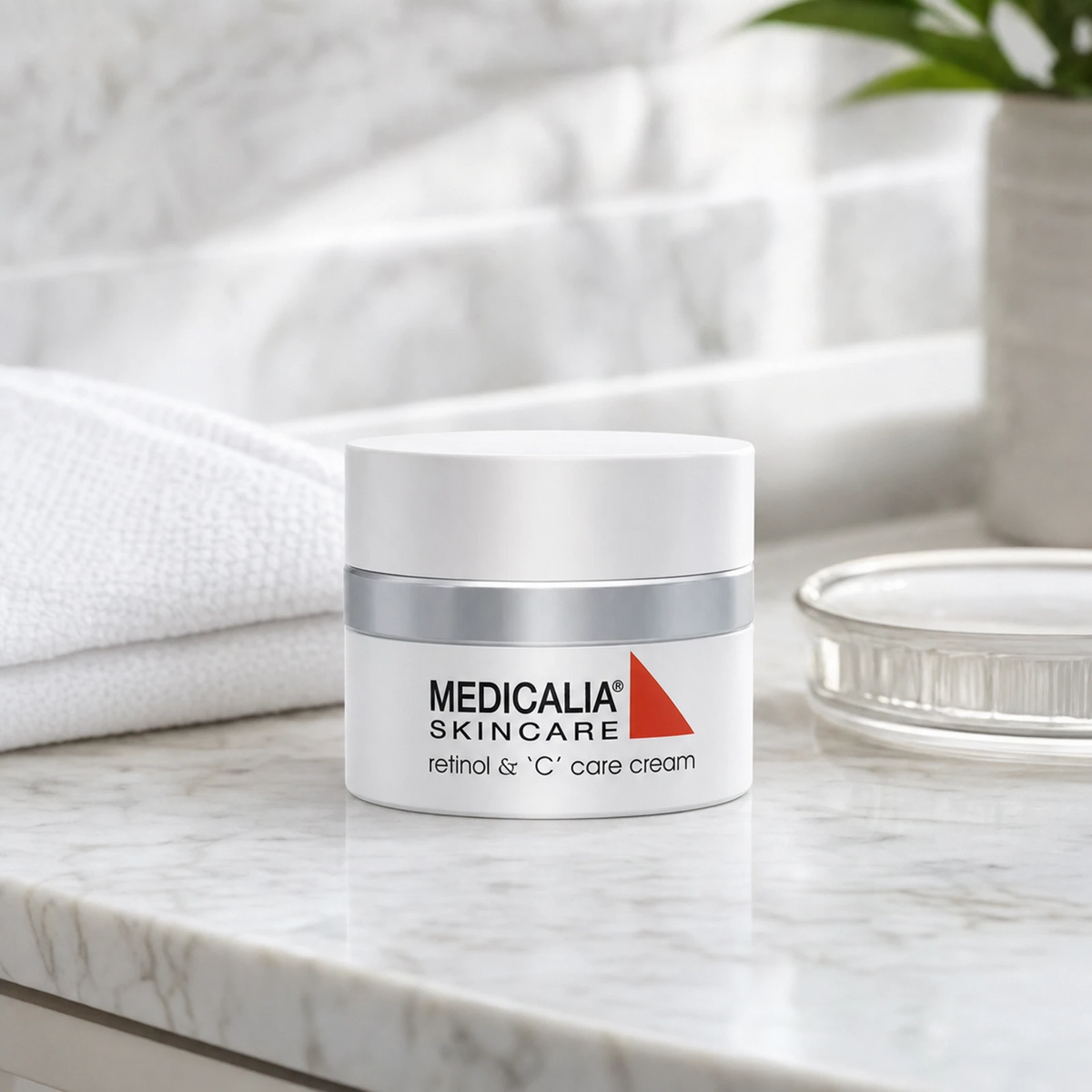 Medicalia Retinol & C Care Cream 50g on a premium marble bathroom vanity, an advanced anti-ageing cream with Micro-Retinol and Vitamin C to smooth, brighten, and rejuvenate skin.