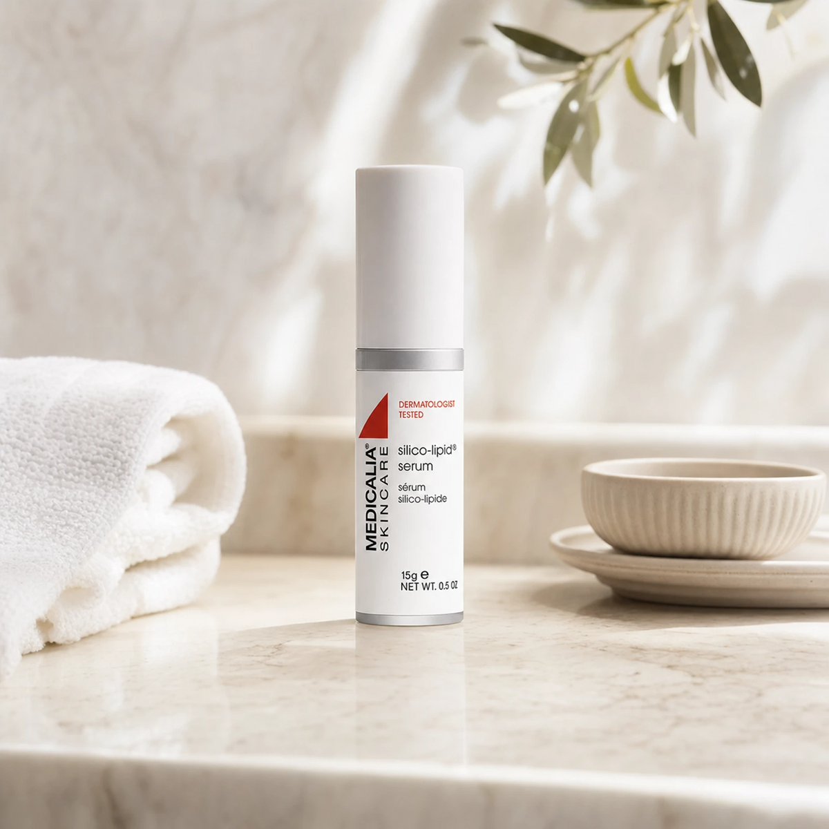Medicalia Silico-Lipid Serum 15g on a premium marble bathroom vanity, a lightweight post-procedure healing serum for scarring, keloids, and sensitive reactive skin.