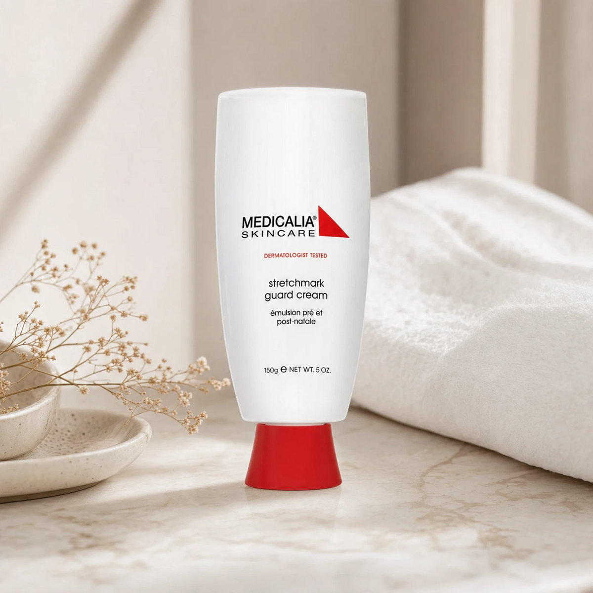 Medicalia Stretchmark Guard Cream 150ml on a premium marble vanity surface, a clinically tested prenatal and post-delivery cream with shea butter and elastin to prevent and improve stretch marks.