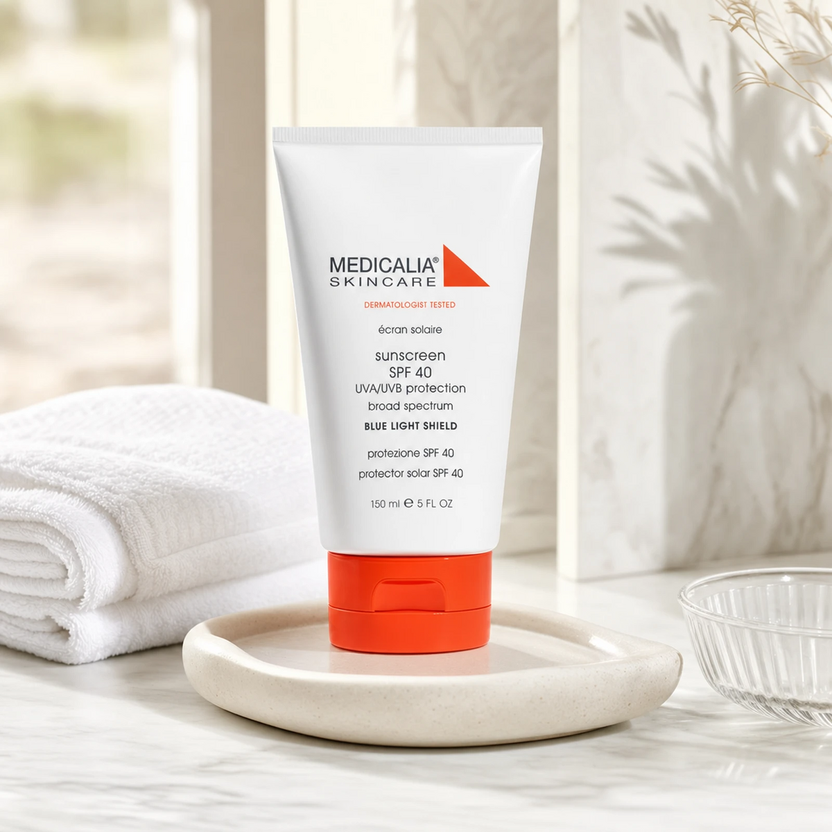 Medicalia Sunscreen SPF 40 with Blue Light Shield 150ml on a premium bathroom vanity, a lightweight mineral sunscreen for daily UV and blue light protection.