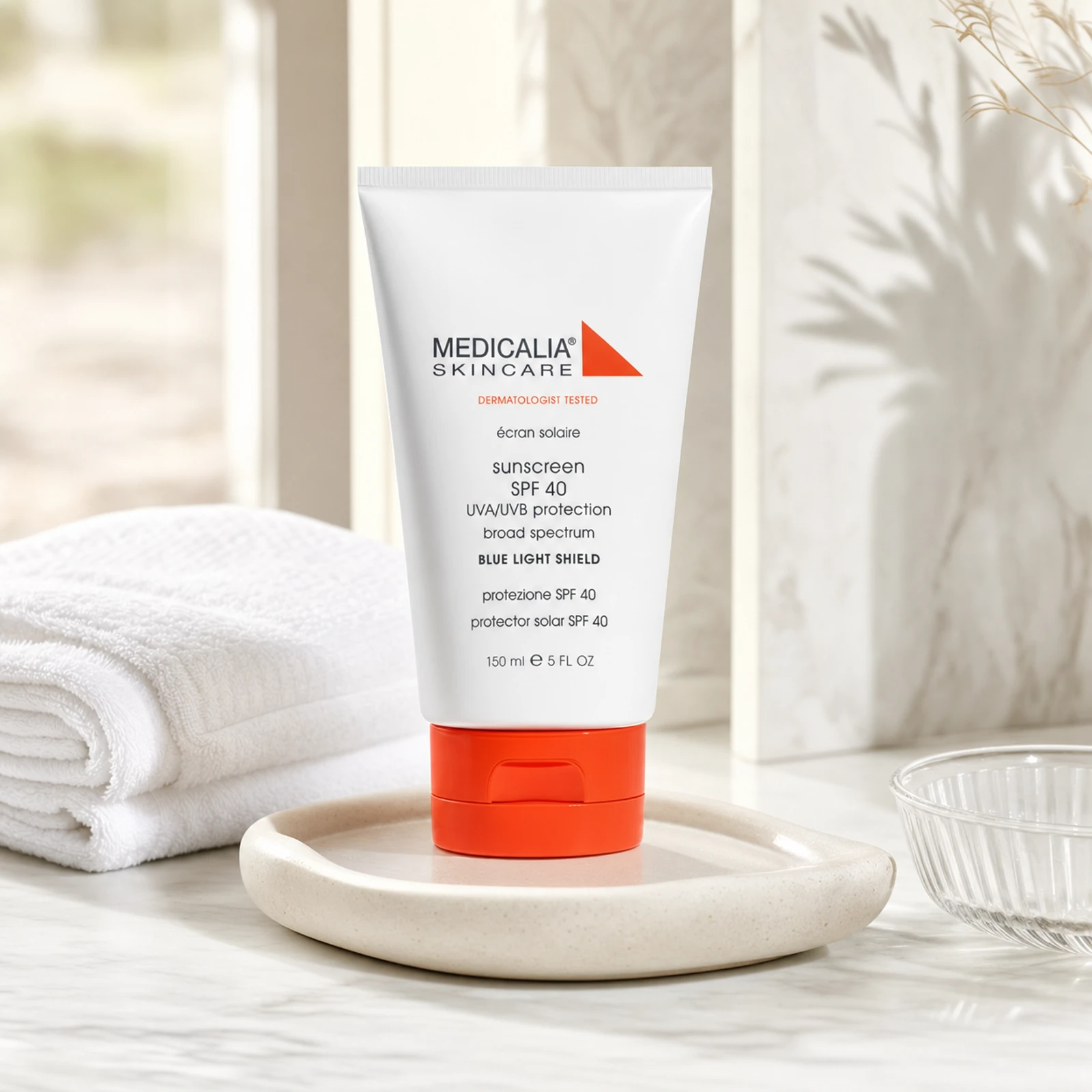 Medicalia Sunscreen SPF 40 with Blue Light Shield 150ml on a premium bathroom vanity, a lightweight mineral sunscreen for daily UV and blue light protection.