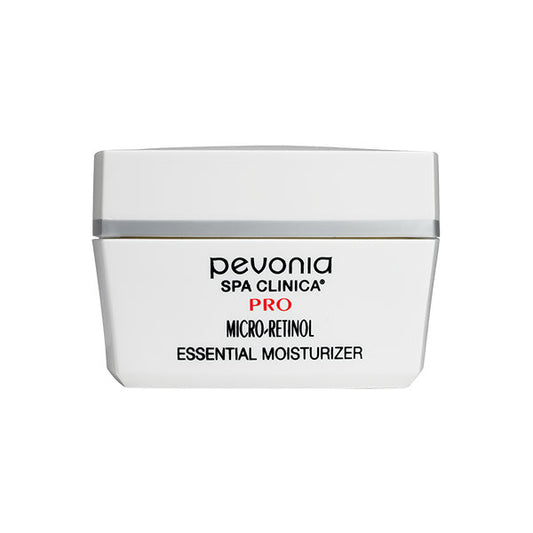 A white jar of Pevonia Micro-Retinol Essential Moisturizer with a silver band and product information on the label.