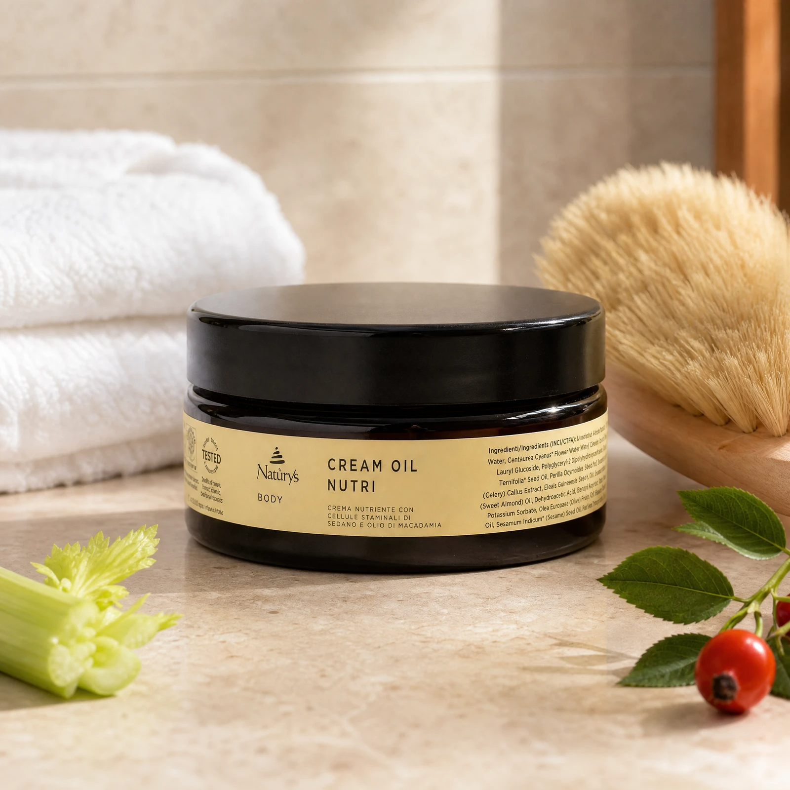 Naturys Body Cream Oil Nutri 250ml premium amber glass jar styled on a marble vanity with white towels and a dry body brush for Beauty Collective consumer retail.