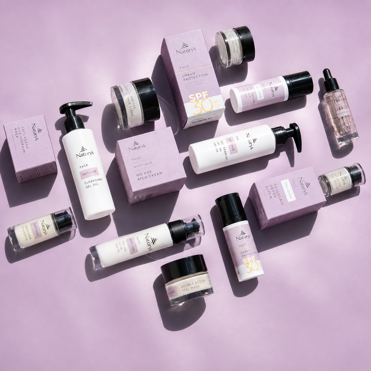 Anti-Age range flat lay skincare products on a light purple background