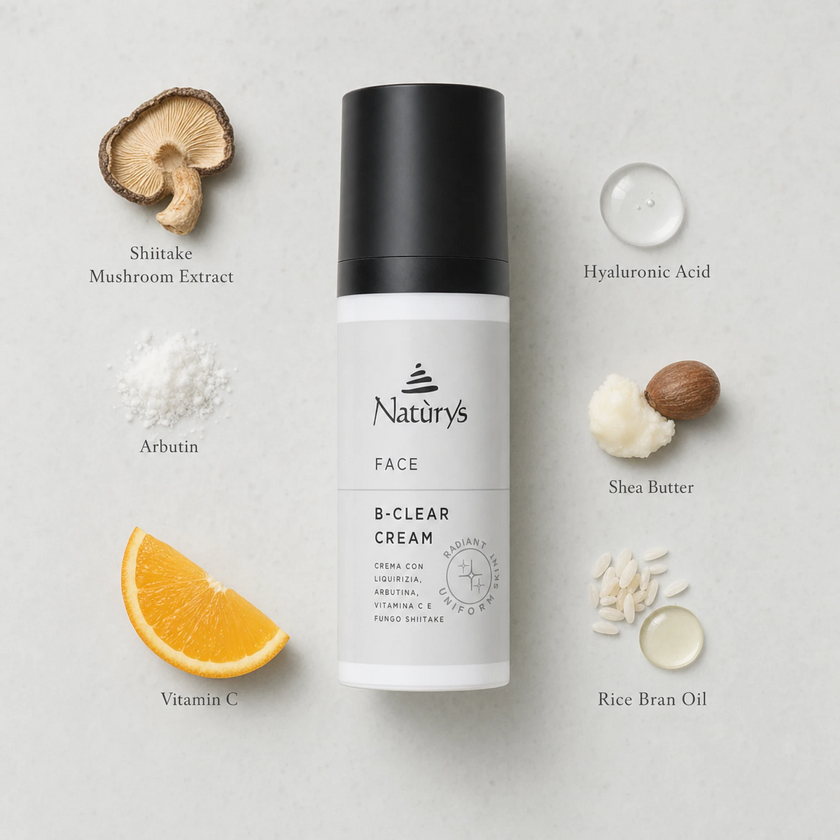 Naturys Face B-Clear Cream 50ml ingredient flatlay on clean pale grey surface with labelled ingredients: Shiitake Mushroom Extract, Arbutin, Vitamin C, Hyaluronic Acid, Shea Butter, and Rice Bran Oil