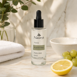 Naturys Face Purifying Peeling AHA Solution 30ml premium clear glass dropper bottle styled on a marble vanity with white towels and greenery for Beauty Collective consumer retail.