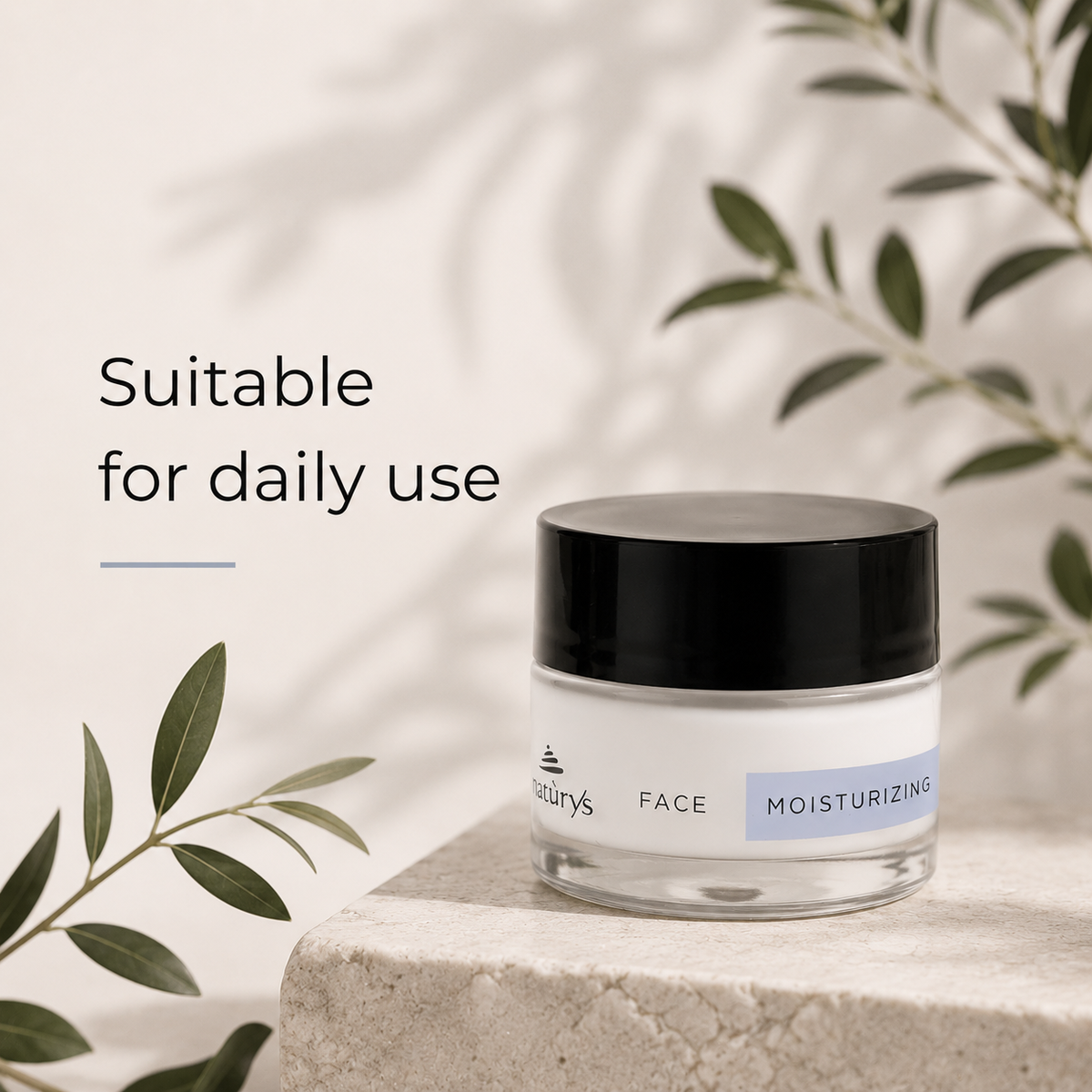 NATURYS Moisturising Hydra Cream 24H - 50ml on a stone surface with green leaves in the background