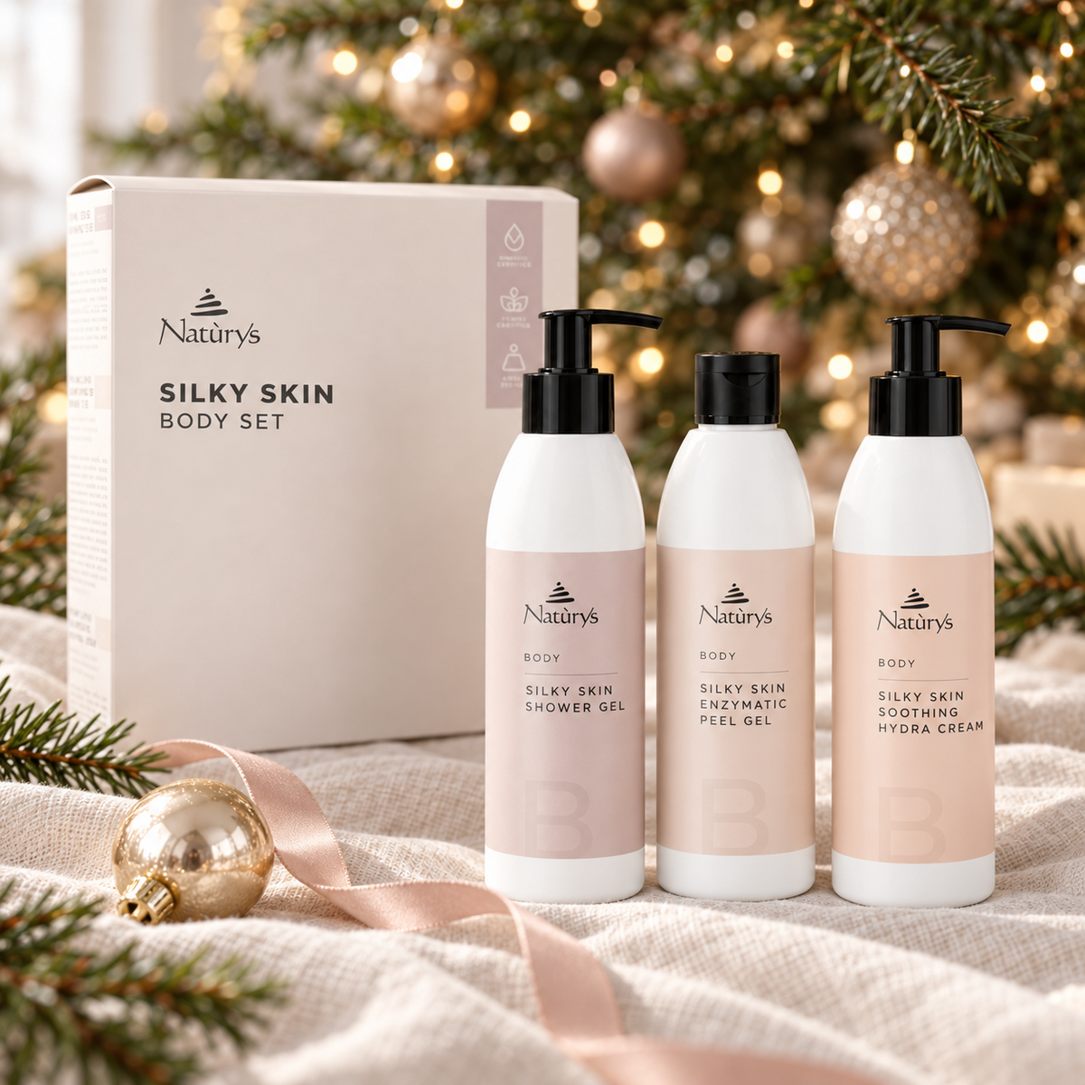 NATURYS Silky Skin Body Set displayed beside a Christmas tree. File: naturys-silky-skin-body-set-christmas-tree-2026.png