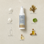 Naturys Sun Cream High Protection SPF 50 Spray 100ml surrounded by labelled key ingredients including Zinc Oxide, Titanium Dioxide, Hyaluronic Acid, Golden Kelp Extract, Centella Asiatica, Argan Oil and Rice Bran Oil on a warm travertine stone surface