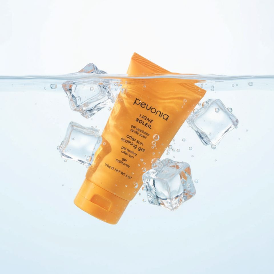 Pevonia after-sun soothing gel with ice cubes on a white background