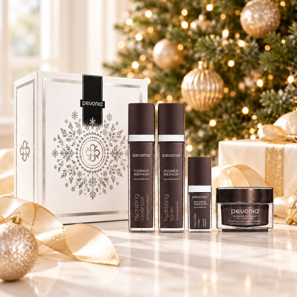 PEVONIA AGE CORRECTION COLLAGEN GIFT BOX displayed beside a Christmas tree. File: pevonia-age-correction-collagen-gift-box-christmas-tree-2026.jpg