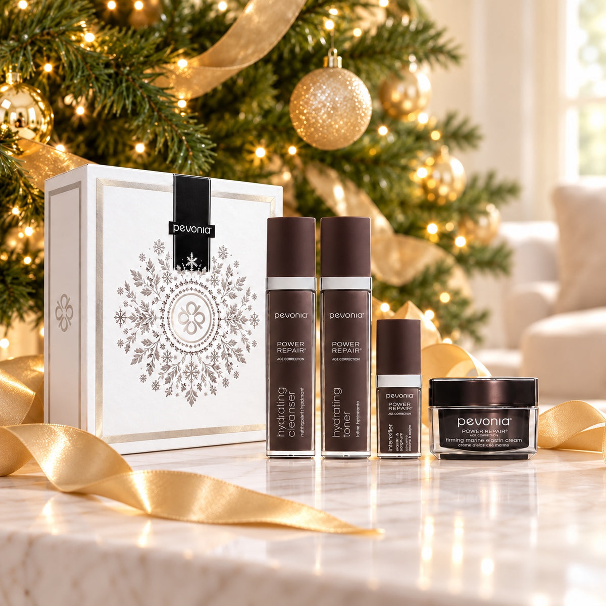 PEVONIA AGE CORRECTION ELASTIN GIFT BOX displayed beside a Christmas tree. File: pevonia-age-correction-elastin-gift-box-christmas-tree-2026.jpg