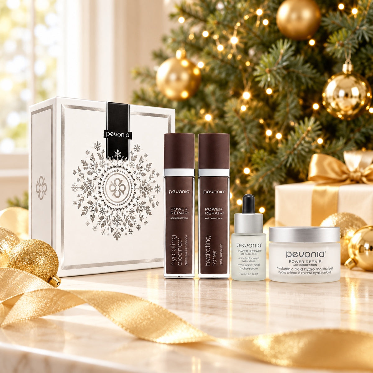 PEVONIA AGE CORRECTION HYALURONIC GIFT BOX displayed beside a Christmas tree. File: pevonia-age-correction-hyaluronic-gift-box-christmas-tree-2026.jpg