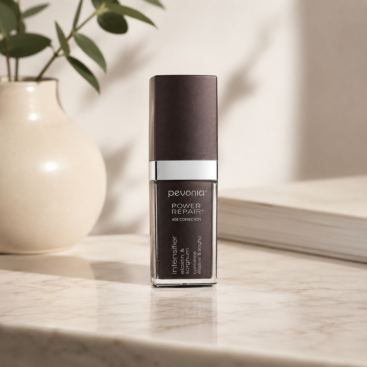 Pevonia Age Correction Intensifier Elastin and Sorghum 30ml on a luxury bathroom vanity for firming, elasticity and mature skin