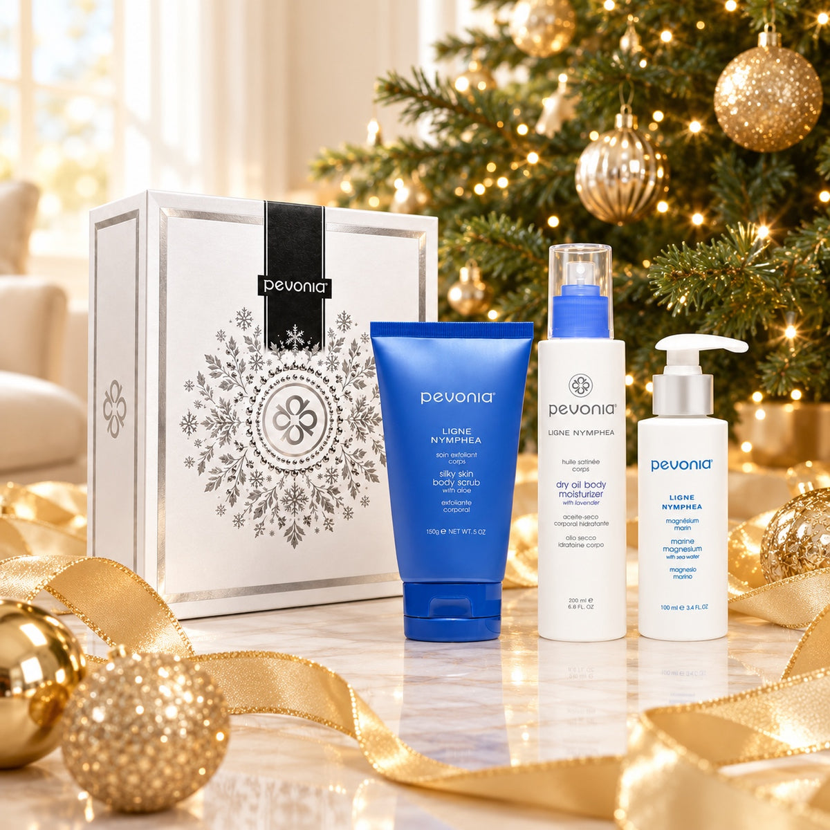 PEVONIA BODY REJUVENATION GIFT BOX displayed beside a Christmas tree. File: pevonia-body-rejuvenation-gift-box-christmas-tree-2026.jpg