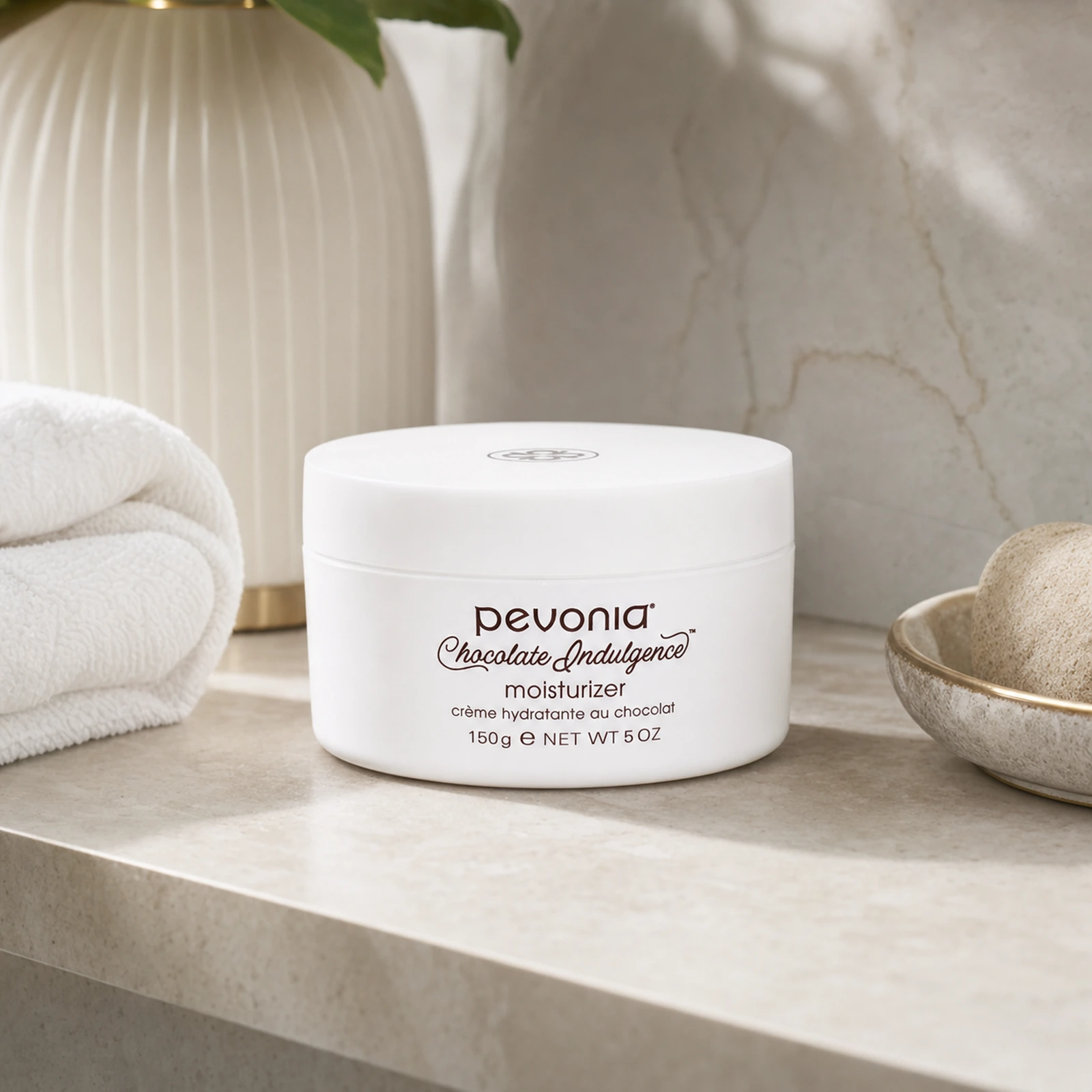 Pevonia Chocolate Indulgence Moisturizer 150ml on a luxury bathroom vanity for deeply nourished, softer and more radiant face and body skin