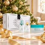 PEVONIA Dry Skin Gift Box displayed beside a Christmas tree. File: pevonia-dry-skin-gift-box-christmas-tree-2026.jpg