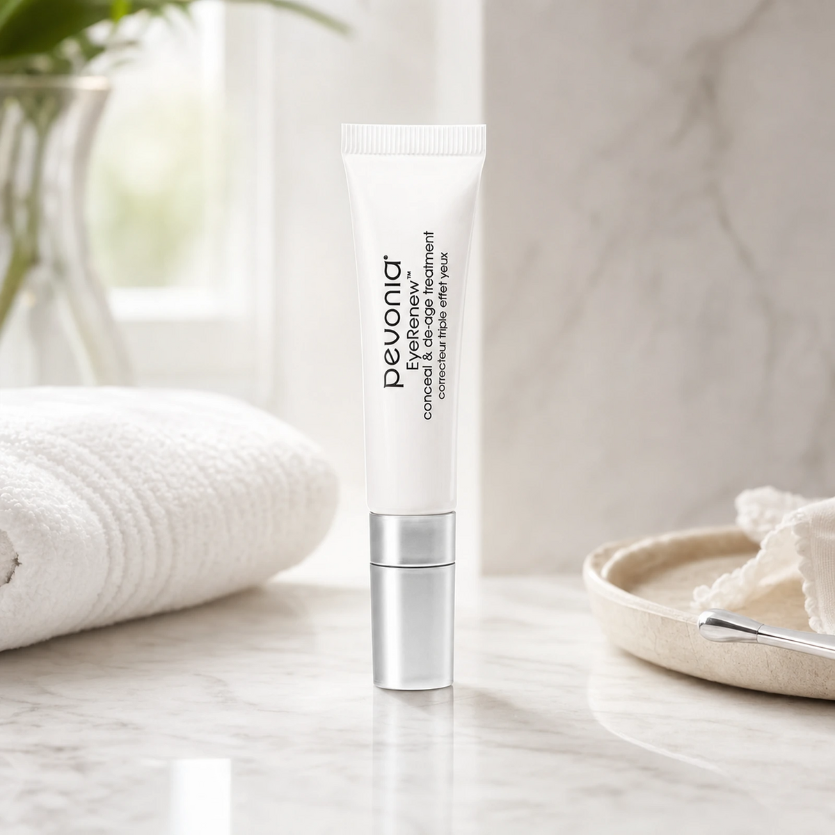 Pevonia EyeRenew Conceal and De-Age Treatment 10ml on a luxury bathroom vanity for fine lines, dark circles and tired eyes