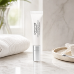 Pevonia EyeRenew Conceal and De-Age Treatment 10ml on a luxury bathroom vanity for fine lines, dark circles and tired eyes