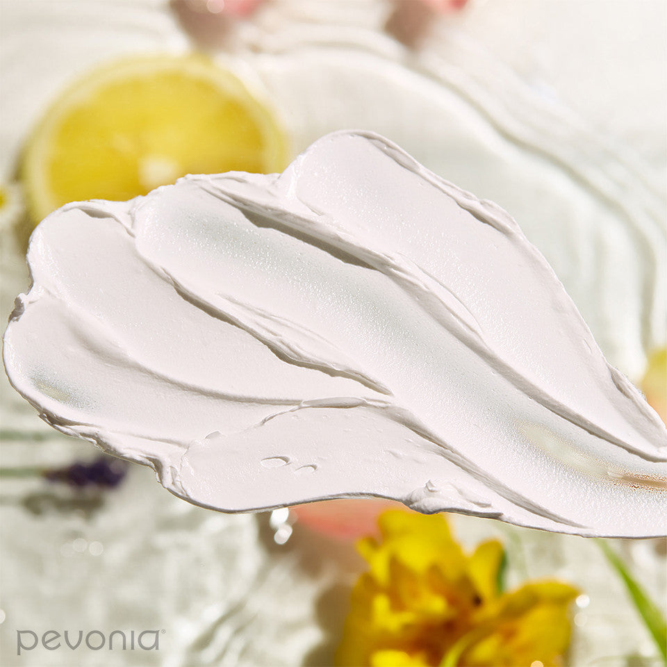 Pevonia Hyaluronic Acid Hydra Mask smear of product indicating Texture and ingredients in the background 