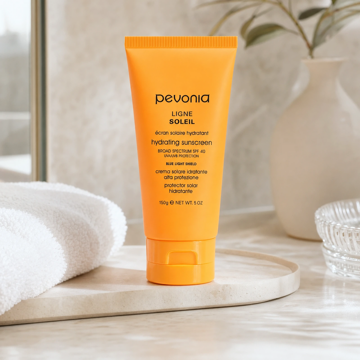 Pevonia Hydrating Sunscreen SPF 40 with Blue Light Shield 150g on a luxury bathroom vanity for daily UV and blue light protection