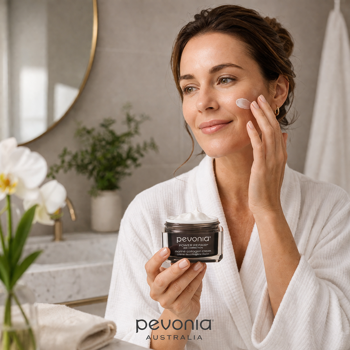 Woman applying Pevonia Marine Collagen Cream in bathroom skincare routine luxury anti ageing moisturiser Australia