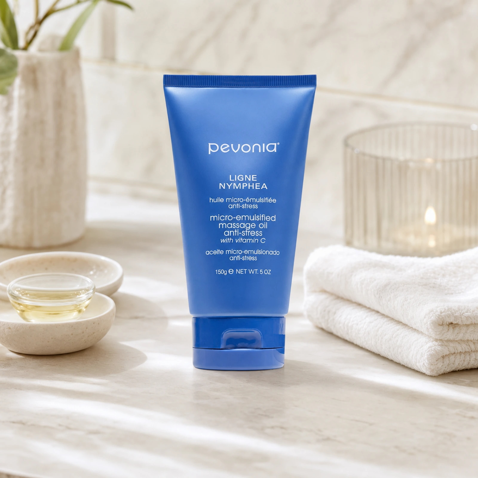 Pevonia Micro-Emulsified Massage Oil Anti-Stress 150g on a luxury bathroom vanity for relaxation, massage glide and nourished skin