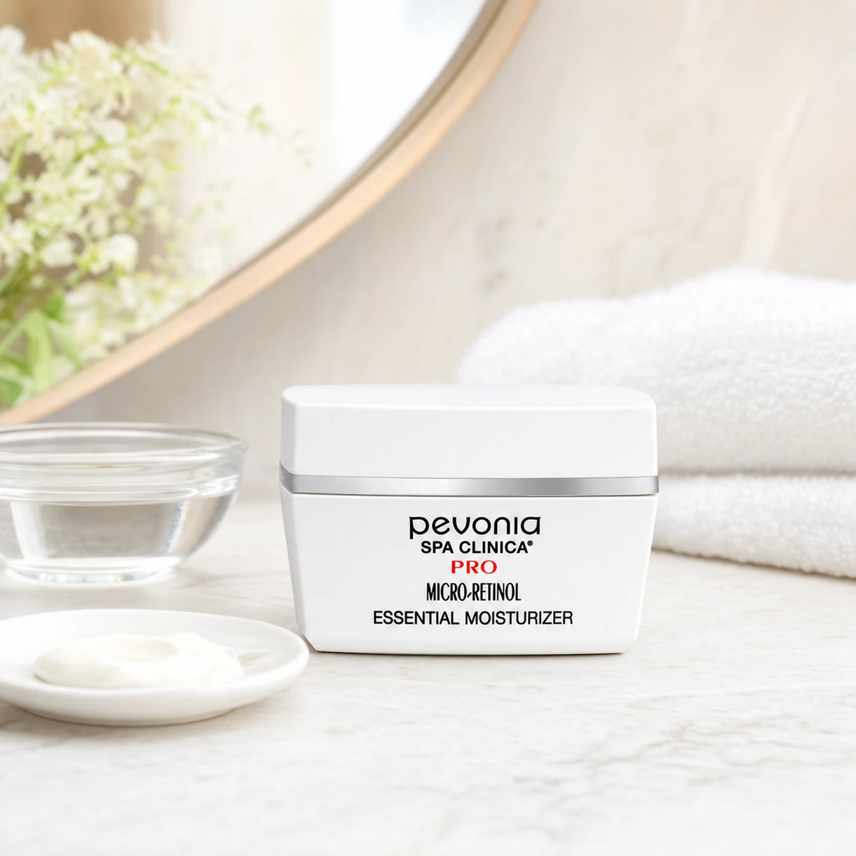 Pevonia Micro-Retinol Essential Moisturiser 50ml on a luxury bathroom vanity for mature, dull and sun-damaged skin