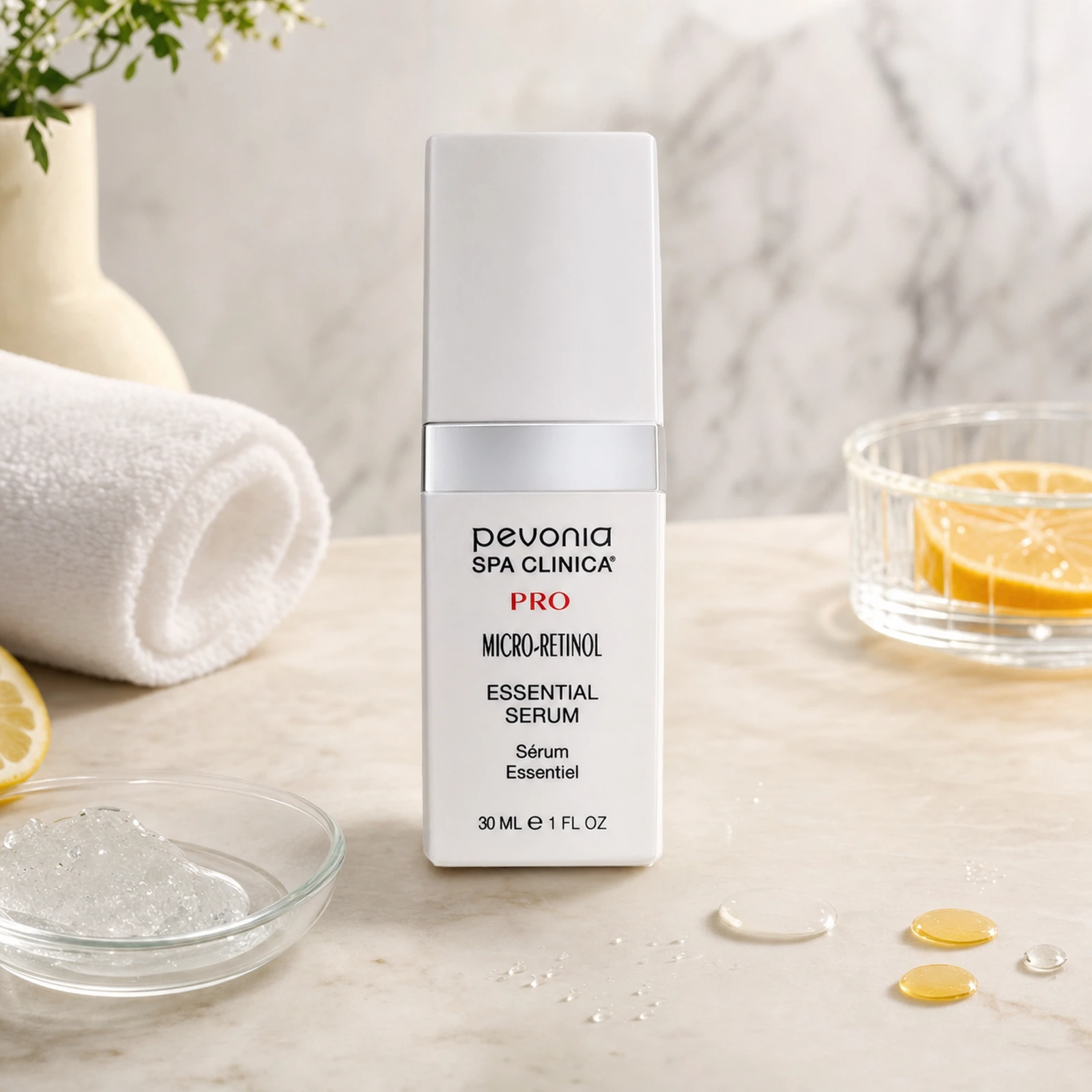 Pevonia Micro-Retinol Essential Serum 30ml on a luxury bathroom vanity for mature, dull and sun-damaged skin