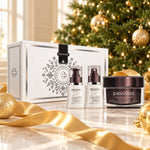 PEVONIA Power Repair Elastin Gift Box displayed beside a Christmas tree. File: pevonia-power-repair-elastin-gift-box-christmas-tree-2026.jpg