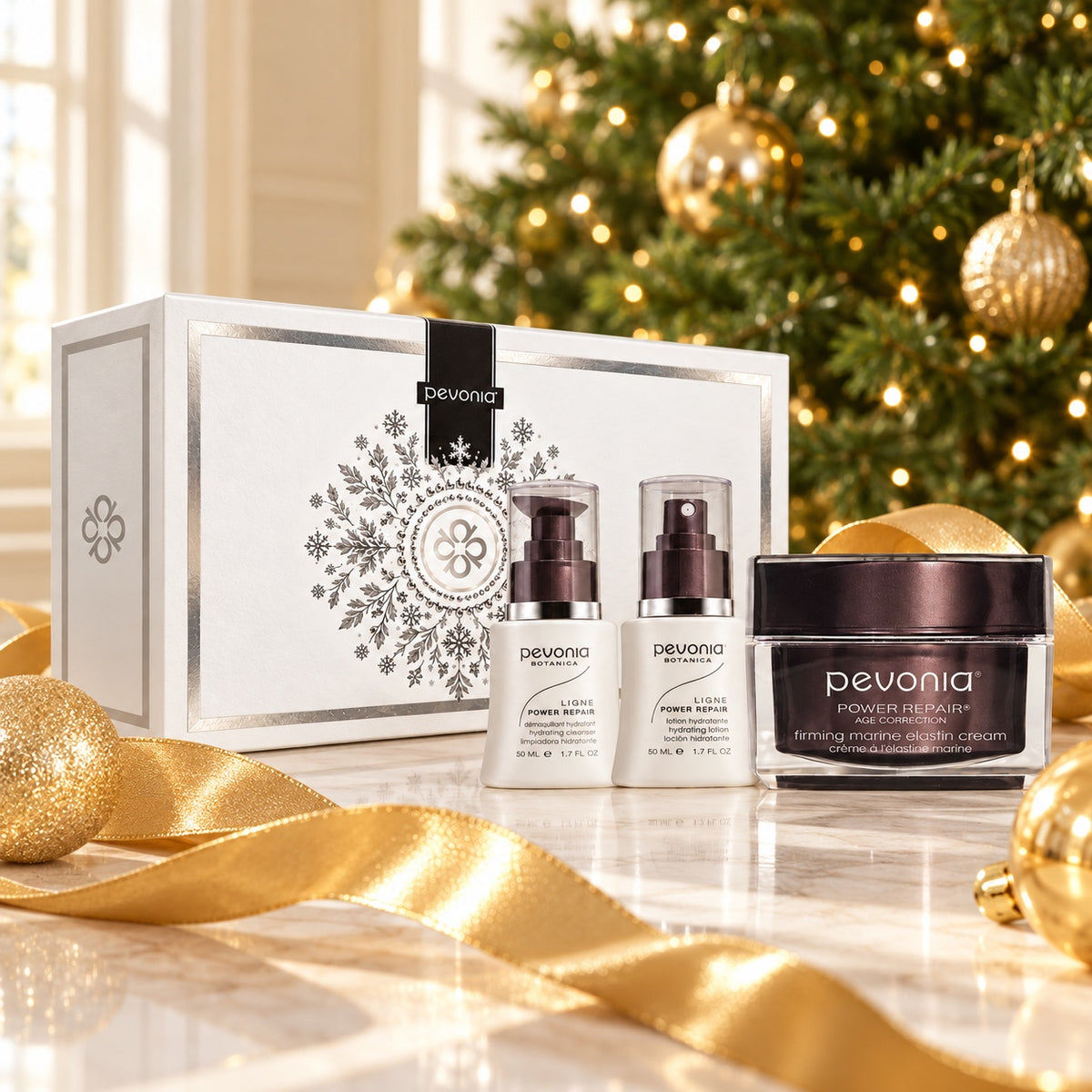 PEVONIA Power Repair Elastin Gift Box displayed beside a Christmas tree. File: pevonia-power-repair-elastin-gift-box-christmas-tree-2026.jpg