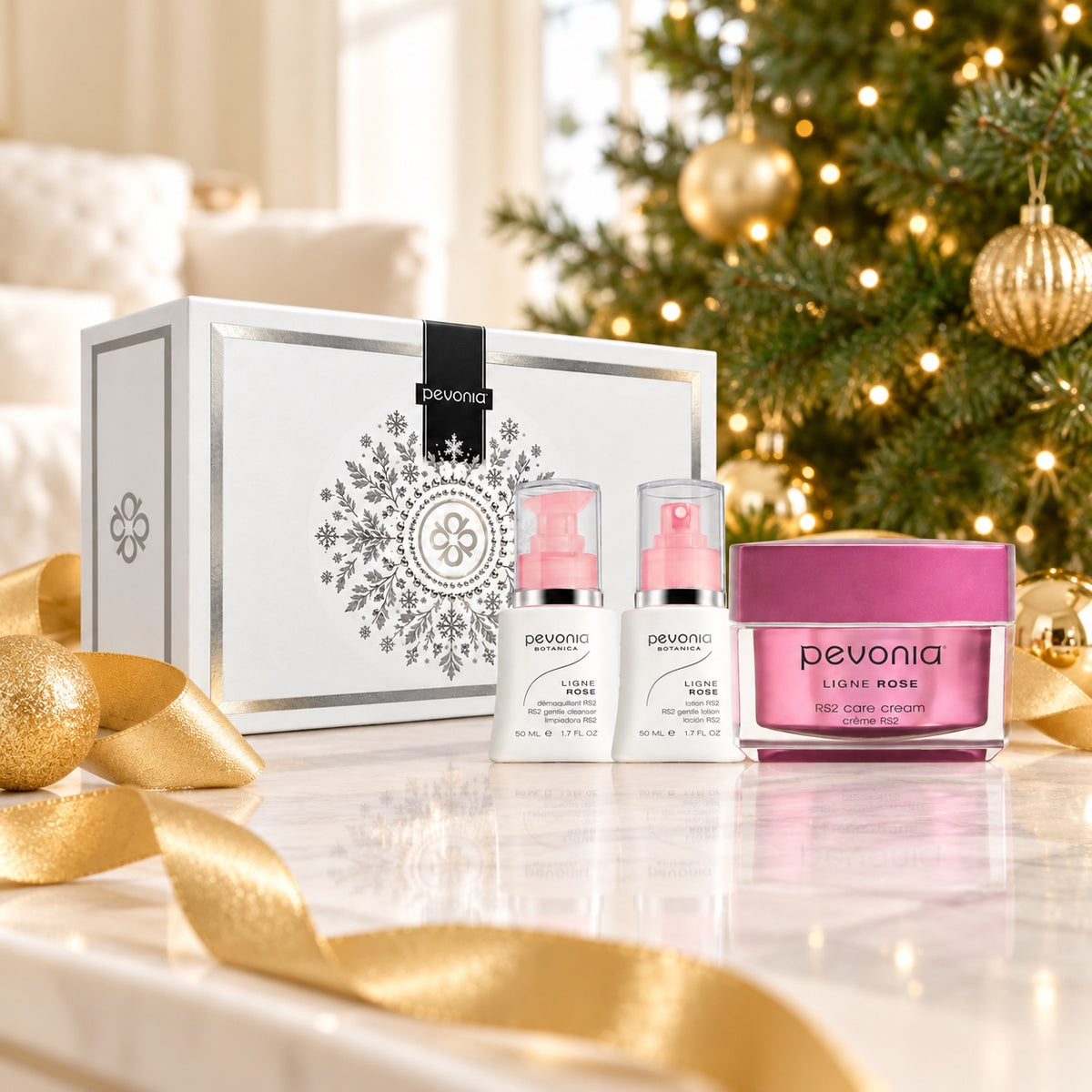 PEVONIA RS2 Ultra Sensitive Skin Gift Box displayed beside a Christmas tree. File: pevonia-rs2-ultra-sensitive-skin-gift-box-christmas-tree-2026.jpg
