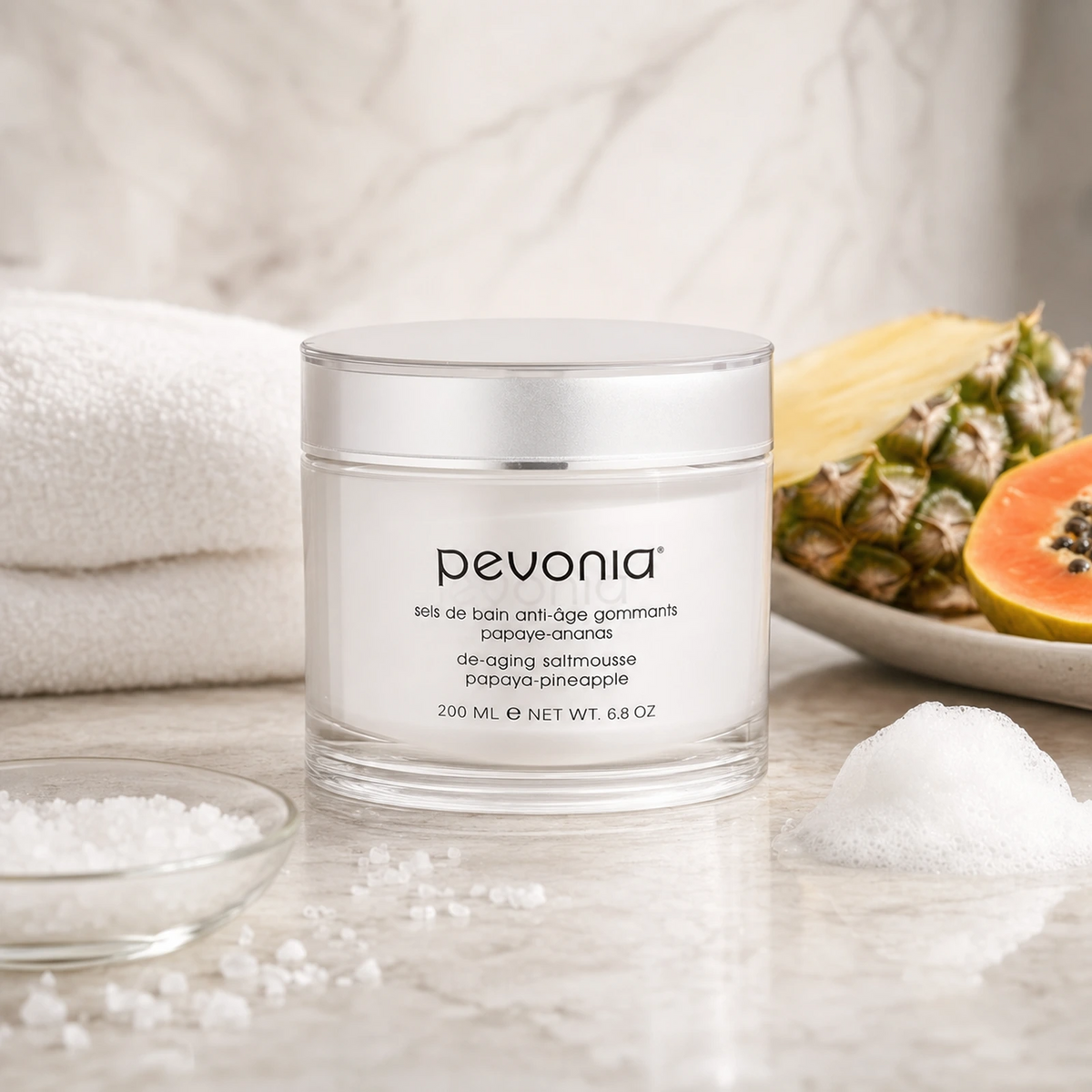 Pevonia Tropicale De-Aging Saltmousse Papaya-Pineapple 200ml on a luxury bathroom vanity for smooth glowing body skin