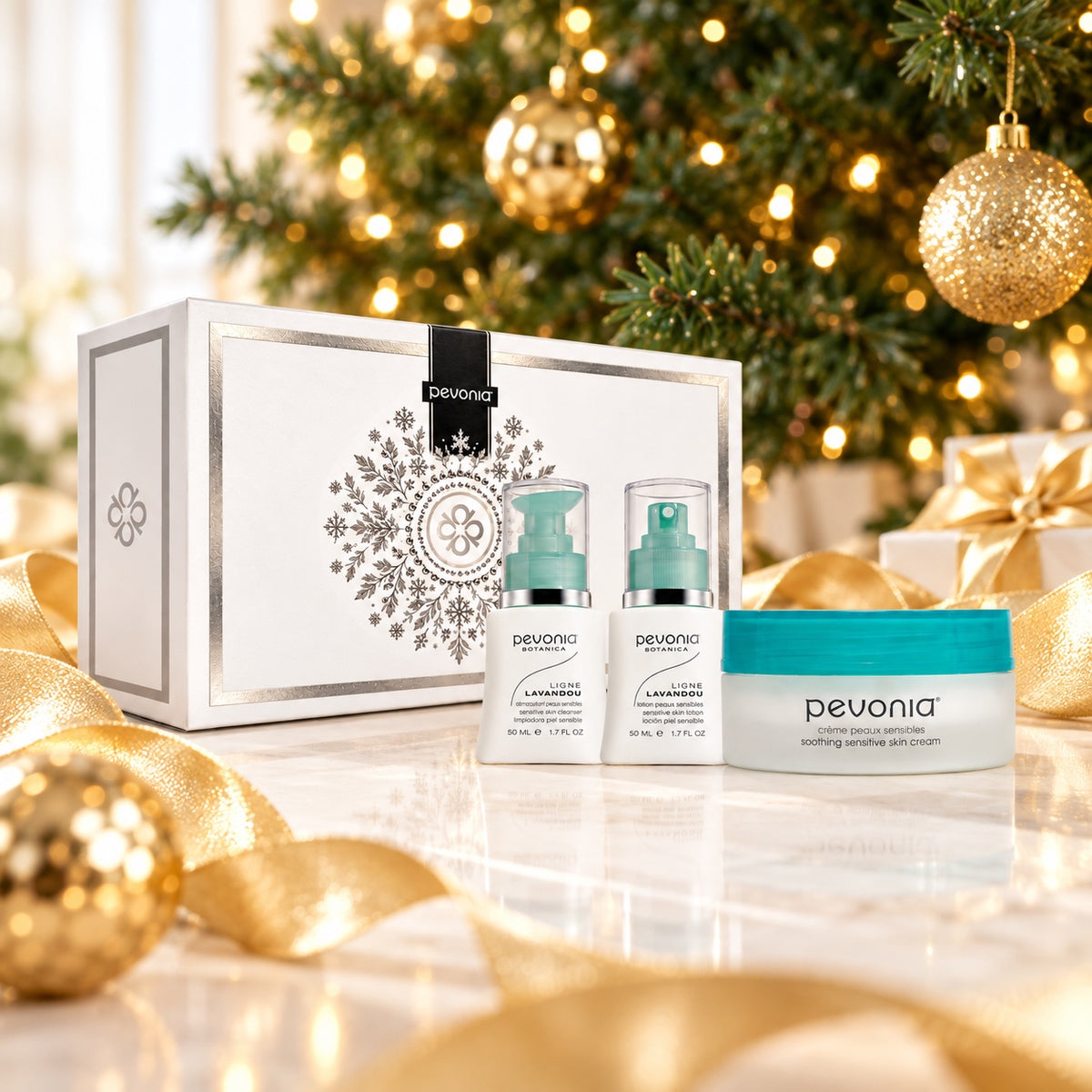 PEVONIA Sensitive Skin Gift Box displayed beside a Christmas tree. File: pevonia-sensitive-skin-gift-box-christmas-tree-2026.jpg