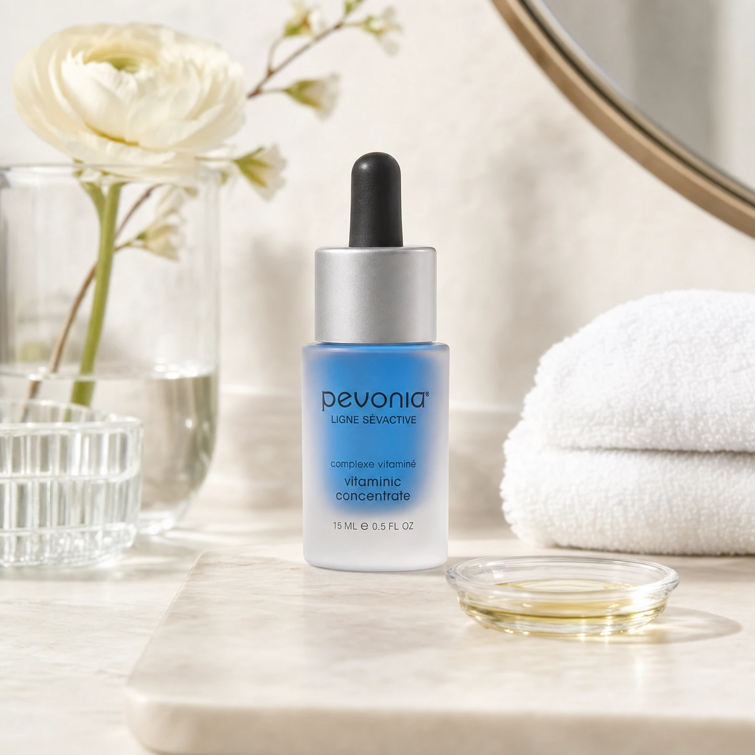 Pevonia Vitaminic Concentrate 15ml on a luxury bathroom vanity for dry, dull and dehydrated skin