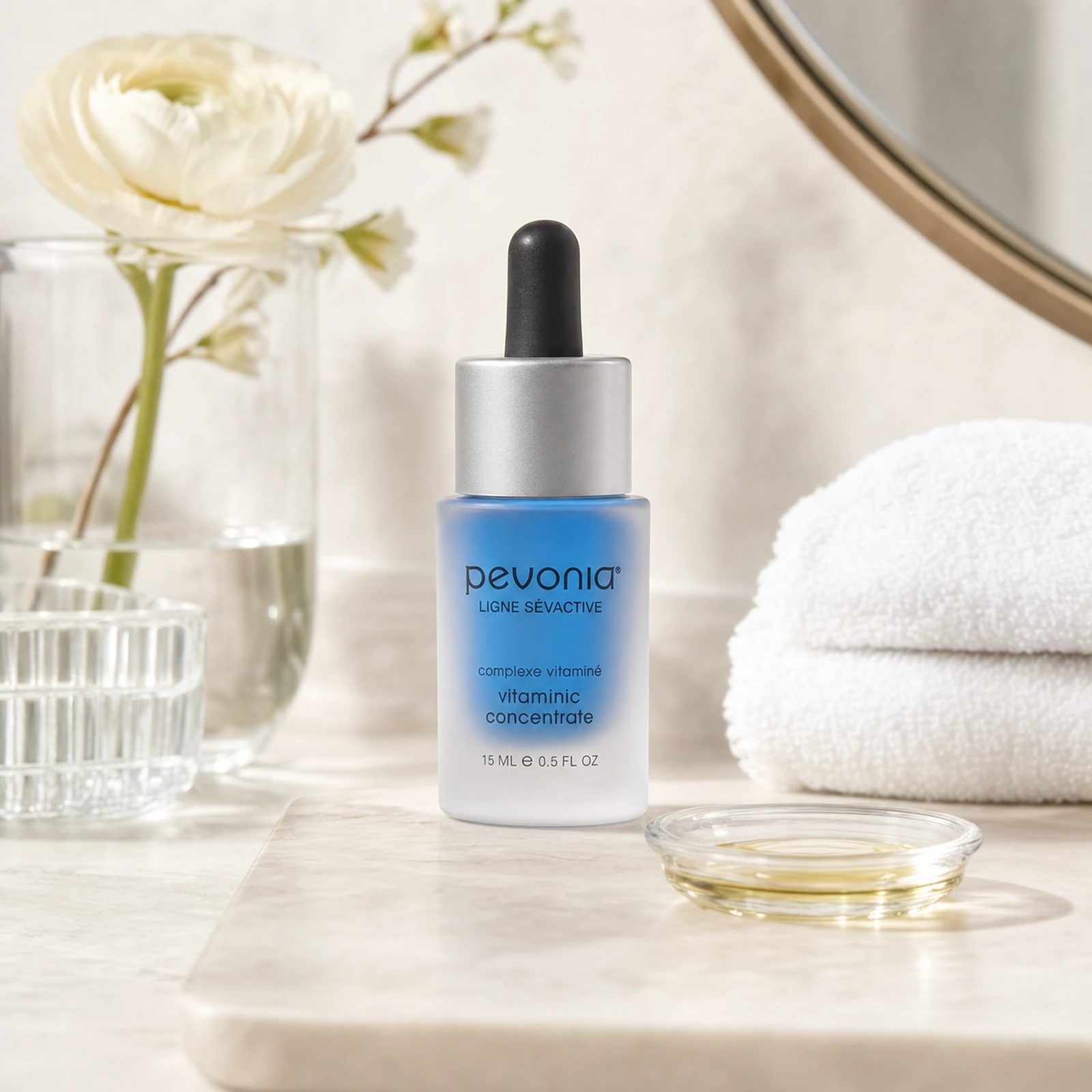 Pevonia Vitaminic Concentrate 15ml on a luxury bathroom vanity for dry, dull and dehydrated skin
