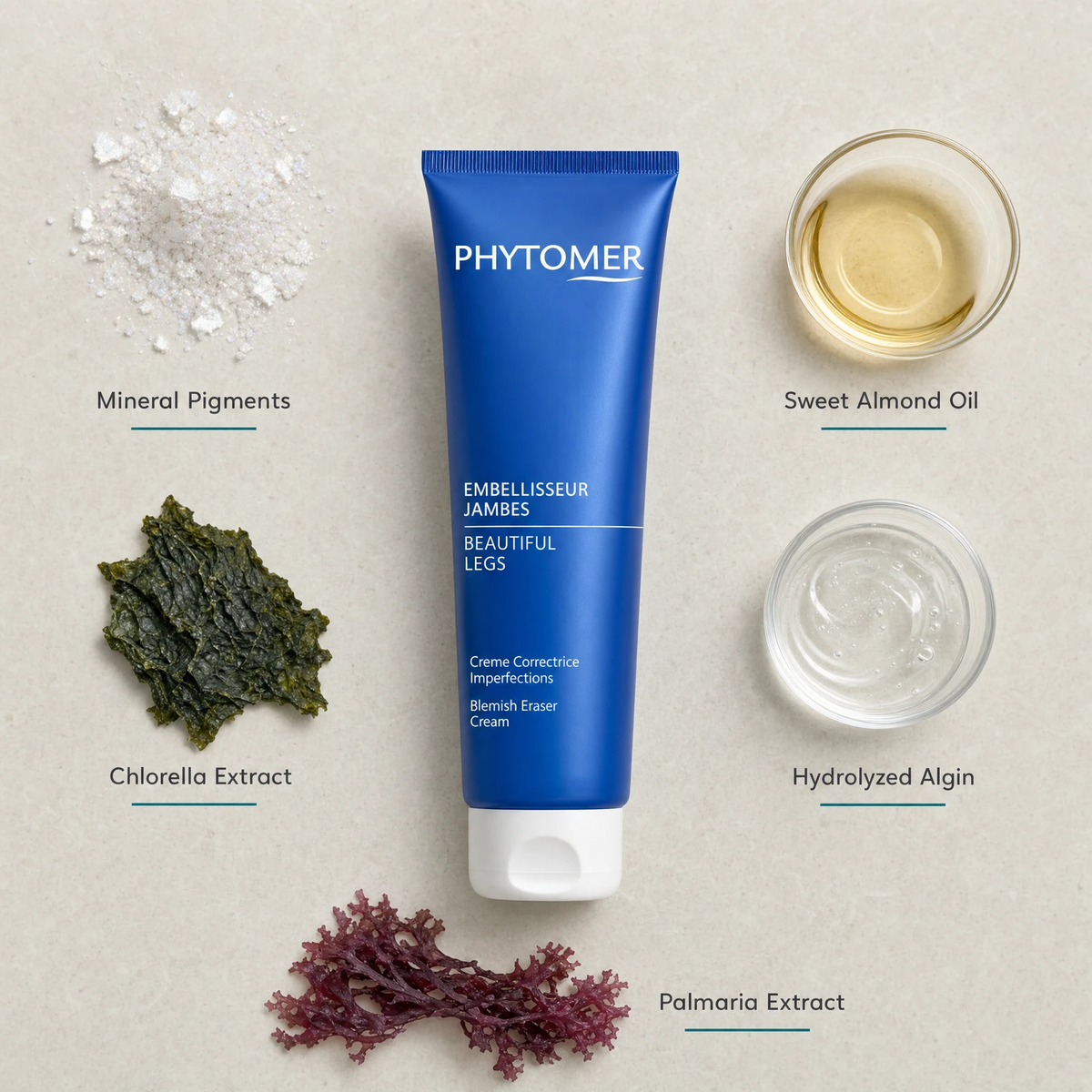 Phytomer Beautiful Legs Blemish Eraser Cream 150ml flatlay on limestone surface with Mineral Pigments, Sweet Almond Oil, Chlorella Extract, Hydrolyzed Algin, and Palmaria Extract