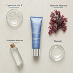 Phytomer Contour Radieux Smoothing and Reviving Eye Mask 30ml flatlay on limestone surface with Liporeductine S, Palmaria Palmata, Sea Water Minerals, and Glycerin