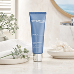 Phytomer Crème 30 Early Wrinkle Plumping Solution Cream 50ml on a marble bathroom vanity with sea fennel, glass vessel, white towels and ceramic tray, premium at-home skincare setting