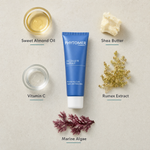 Phytomer Decollete Parfait Neck and Decollete Renewing Care 50ml flatlay on limestone surface with Sweet Almond Oil, Shea Butter, Vitamin C, Rumex Extract, and Marine Algae