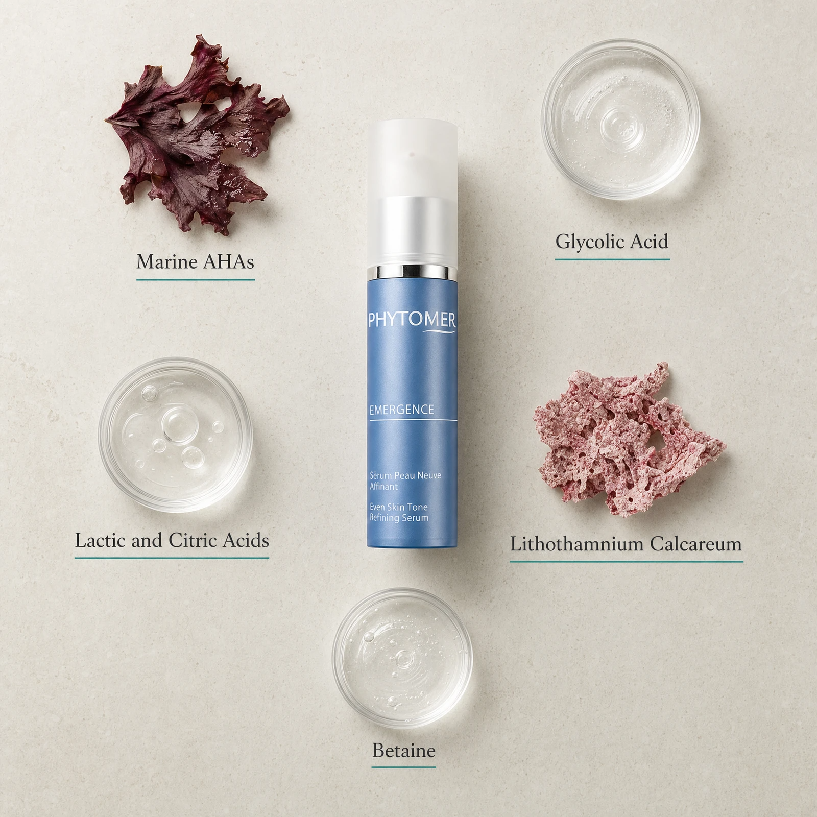 Phytomer Emergence Even Skin Tone Refining Serum 30ml flatlay on limestone surface with Marine AHAs, Glycolic Acid, Lactic and Citric Acids, Lithothamnium Calcareum, and Betaine