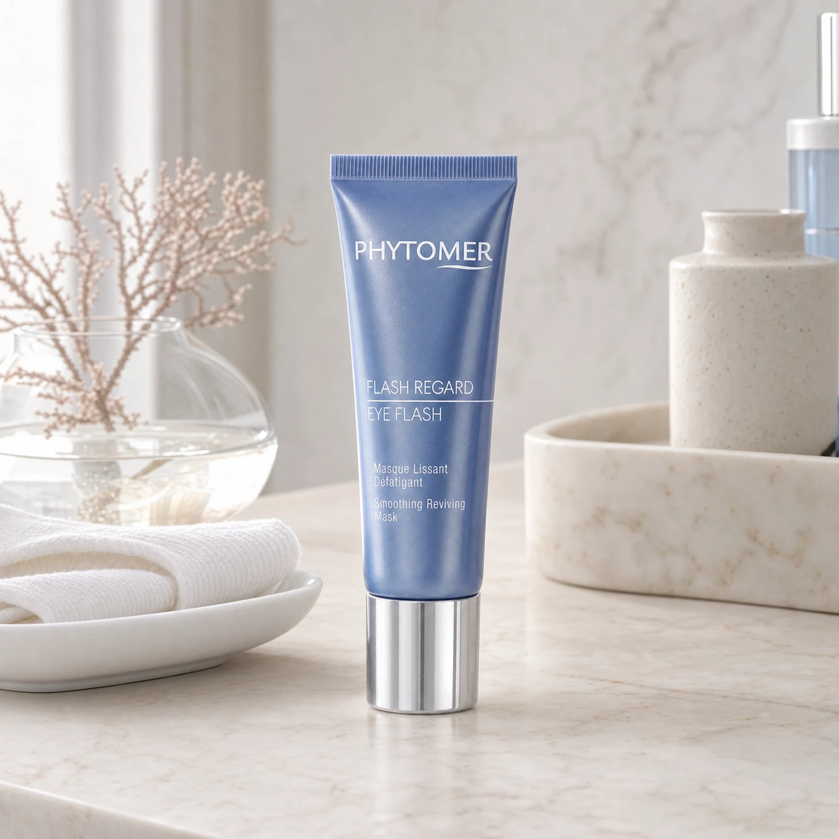 Phytomer Eye Flash Smoothing Reviving Mask 30ml on a marble bathroom vanity with sea coral, glass vessel, white towels and ceramic tray, premium at-home skincare setting