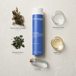 Phytomer Gentle Illuminating Shampoo with Marine Plants 250ml flatlay on limestone surface with Marine Plant Complex, Hydrolyzed Algin, Chlorella Extract, Vegetal Oils, and Sea Water