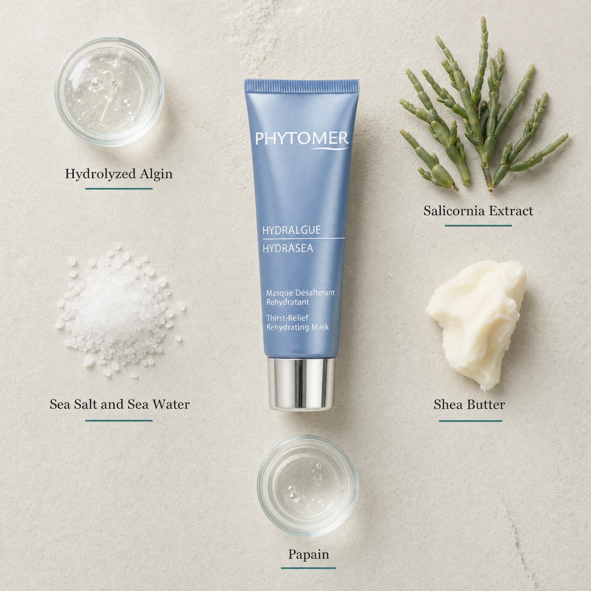Phytomer Hydrasea Thirst-Relief Rehydrating Mask 50ml flatlay on limestone surface with Hydrolyzed Algin, Salicornia Extract, Sea Salt and Sea Water, Shea Butter, and Papain