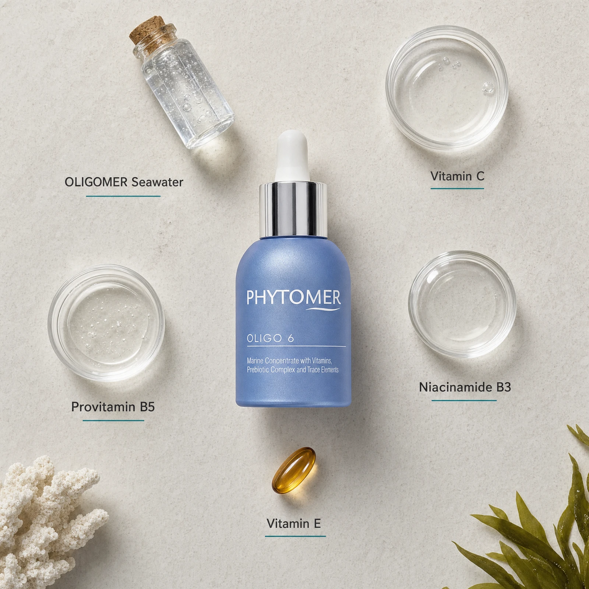 PHYTOMER Oligo 6 - Marine Concentrate with Vitamins, Prebiotics & Trace Elements 30ml flatlay on limestone surface with OLIGOMER Seawater, Vitamin C, Provitamin B5, Niacinamide B3, and Vitamin E