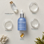 PHYTOMER Oligo 6 - Marine Concentrate with Vitamins, Prebiotics & Trace Elements 30ml flatlay on limestone surface with OLIGOMER Seawater, Vitamin C, Provitamin B5, Niacinamide B3, and Vitamin E