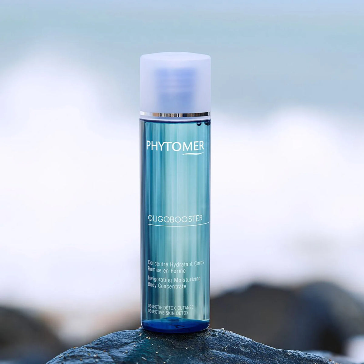 Phytomer Oligobooster Invigorating Moisturizing Body Concentrate 125ml on a rock with a blurred background