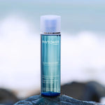 Phytomer Oligobooster Invigorating Moisturizing Body Concentrate 125ml on a rock with a blurred background
